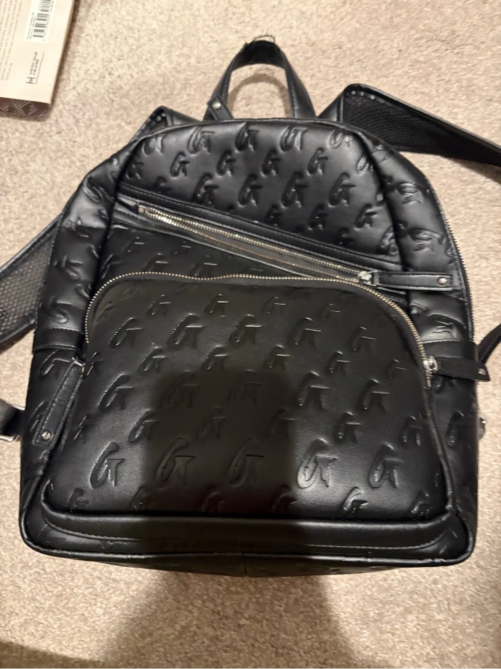 Monogram-Embossed Black Mini Backpack - Sleek Everyday Carry